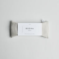 A rectangular linen Bodha - Aromatherapy Eye Pillow with a white label is displayed on a light gray background.