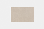 A Ribbed Wool Rug in a square shape and beige color is centered on a plain white background.