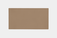 A rectangular, light brown Leather Tops placemat with a smooth texture is centered on a plain white background.