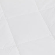 Close-up of the Down Alternative Duvet Insert’s white quilted fabric with a square pattern, highlighting its stitching lines and soft texture.