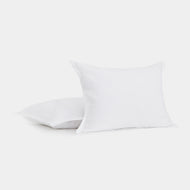 Two Linen Sham Set pillows are displayed against a white background, with one pillow standing upright in front and the other lying flat behind it.