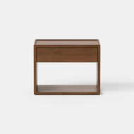 The Classic Nightstand, 26″ features a minimalist walnut wood design with a single push-to-open drawer, a lipped top, and an open lower shelf, shown against a white background.