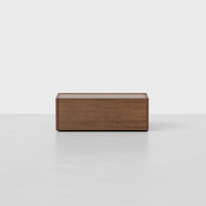 The Essential Storage Table, featuring a smooth finish, stands on a plain light gray surface with a white background.