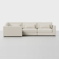 The Signature L Sectional is a modern, light beige L-shaped sofa featuring three seat cushions, three back cushions, and three matching lumbar pillows, shown against a plain white background.