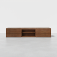 The Nest Credenza is a low, rectangular wooden media console with a smooth finish, six drawers (three per side), and two open center shelves. It sits on a light gray floor against a plain white background.