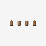 Four Classic Nightstand Legs, small and cylindrical with short gold-colored stems, are evenly spaced in a row on a plain white background.